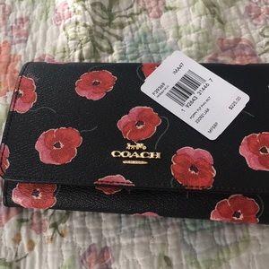 Coach wallet with wrist strap. Poppy print